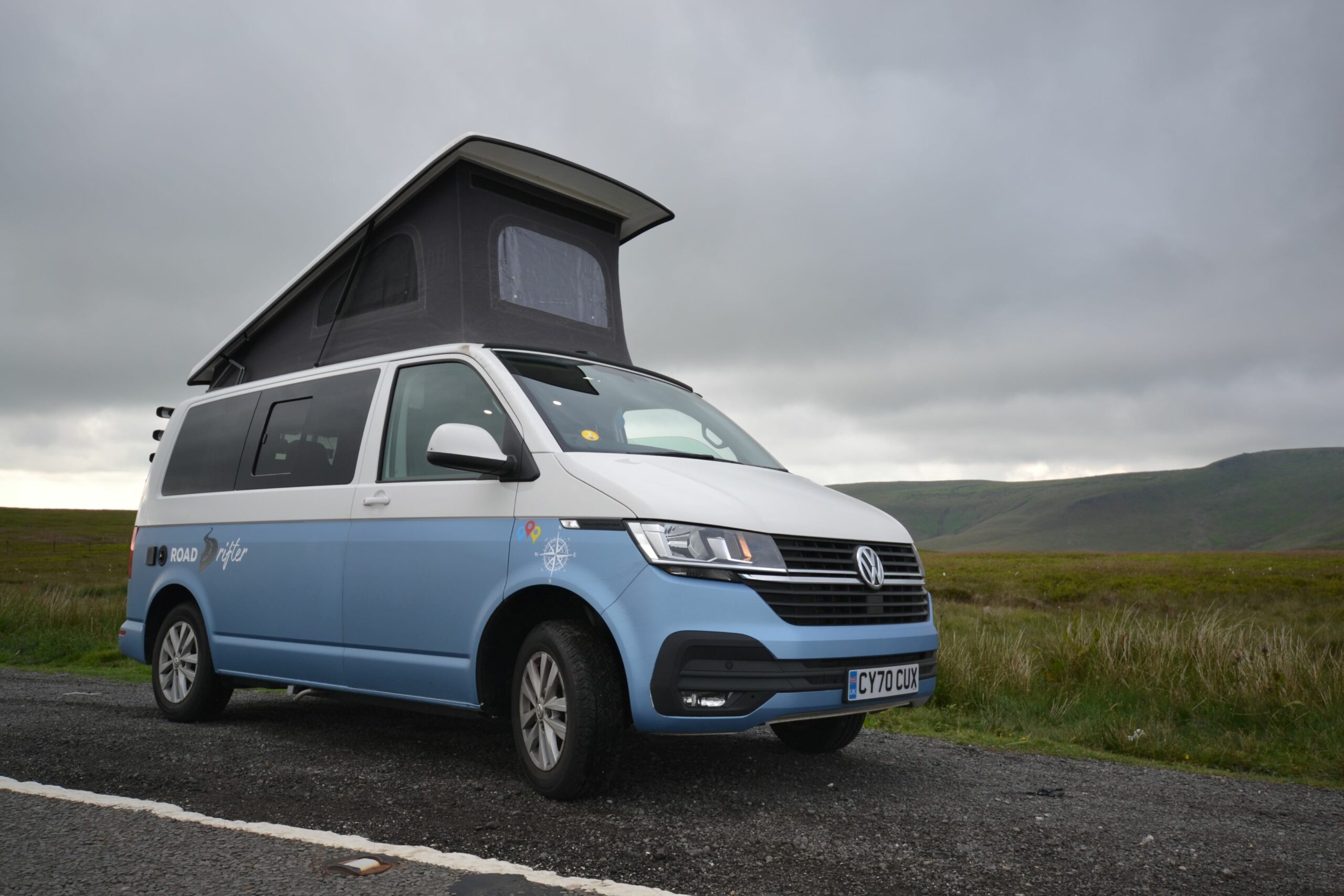 blue road drifter 2 in situ parked on the side of the road with roof popped up